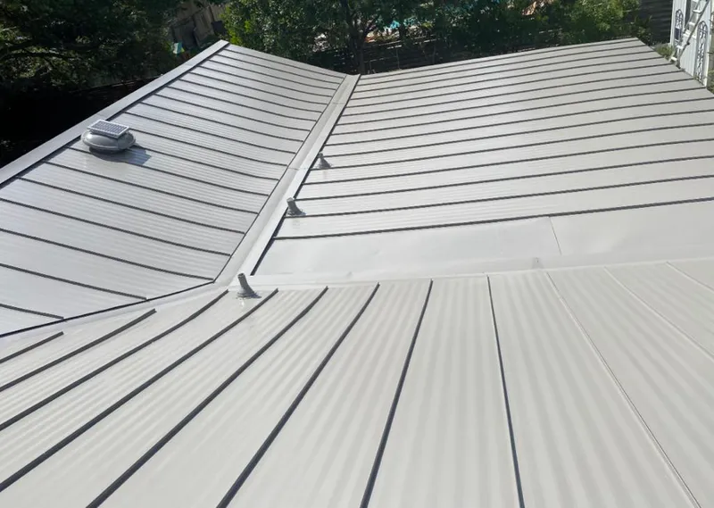 Solar attic fan installed on a metal roof for Roof Ventilation in Phoenix